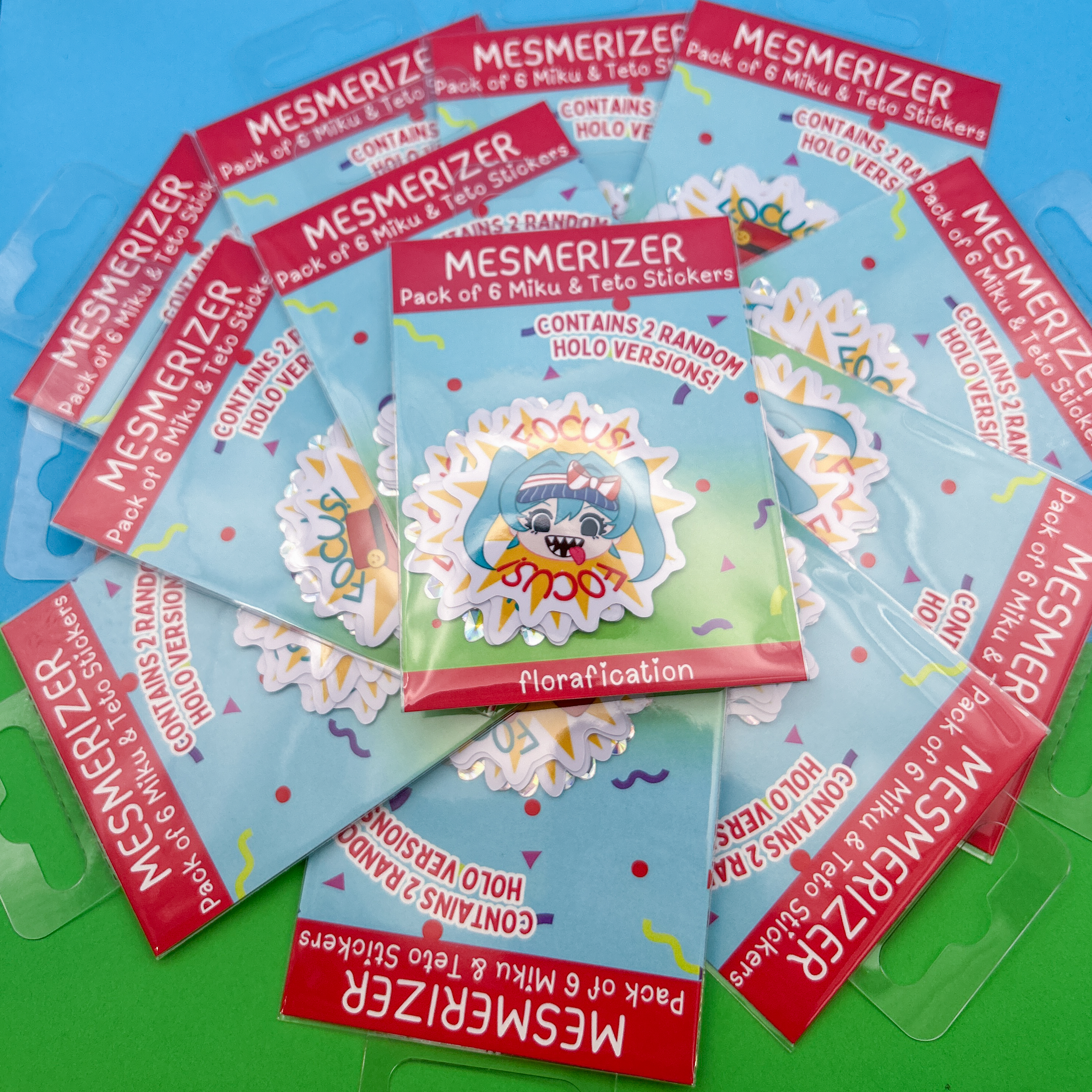 Mesmerizer Sticker Pack - A pack of stickers based off of the Miku and Teto from the Vocaloid song Mesmerizer by 32ki. The sticker packs are arranged in a spiral pattern.